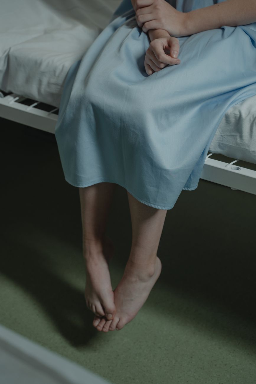 a person sitting on the hospital